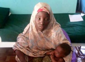 Undated picture released May 18, 2016 by Nigeria army of rescued Chibok schoolgirl and her baby in Maiduguri, Nigeria.  Nigeria Military/Handout via REUTERS TV
