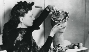 2. Woman making a hat from wood shavings