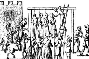 Suspected witches being hanged for the crime of witchcraft.