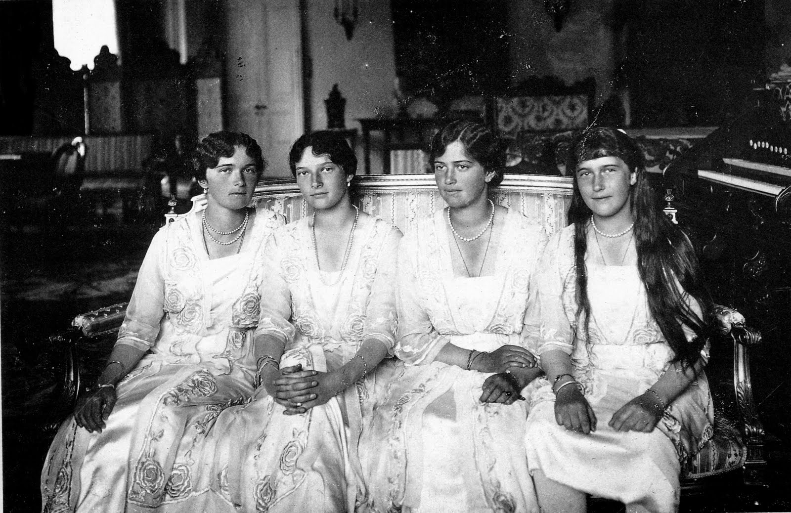 The four Russian princesses, Olga, Tatiana, Maria, and Anastasia, seated together.