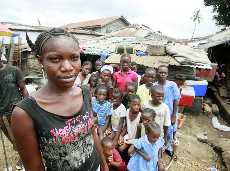 Catherine Nagbe, 21,stands outside her home in Monrovia, Liberia, Sunday, March 6, 2011. Catherine is confronting challenges faced by adolescent girls including health, safety, education and training needs. The UN Foundation's Girl Up Campaign is visiting programs in Liberia as part of its efforts to build awareness and support for United Nations programs in conjunction with International Women's Day. (Stuart Ramson/Insider Images for the United Nations Foundation)
