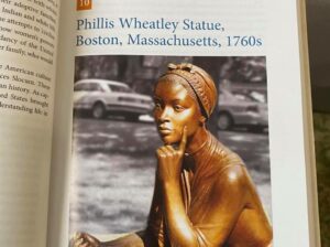 Photograph of page of a book showing statue of Phyllis Wheatley
