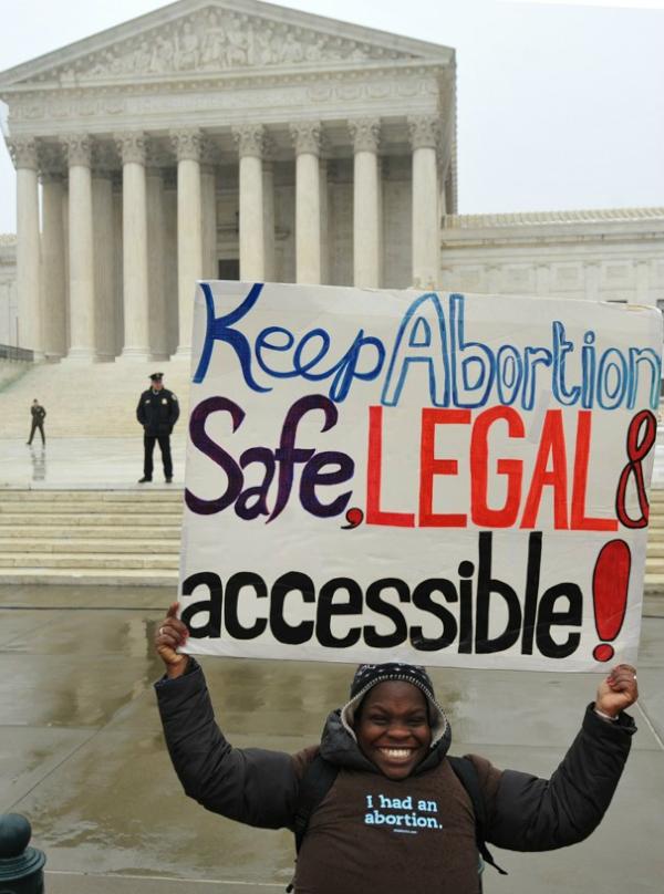 A person who has had an abortion demonstrates with a sign that they believe in the right to safe and legal abortion that is accessible to all. This is representative of the "pro-choice" movement that advocates for the right of women to choose what to do with their bodies and be able to access abortion without legal ramifications.